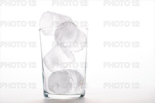 Close-up of an empty glass with ice isolated on a white background