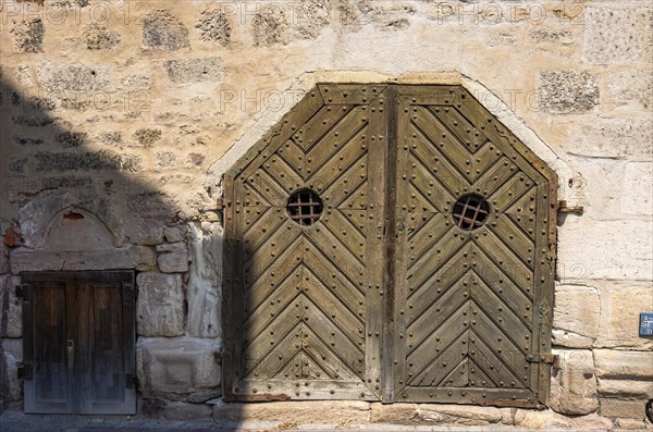 Old historic and weathered gate to a cellar in the old town of Tuebingen