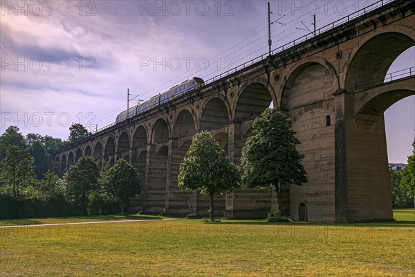 A train passes over the historic Enzviaduct railway viaduct in the town of Bietigheim-Bissingen