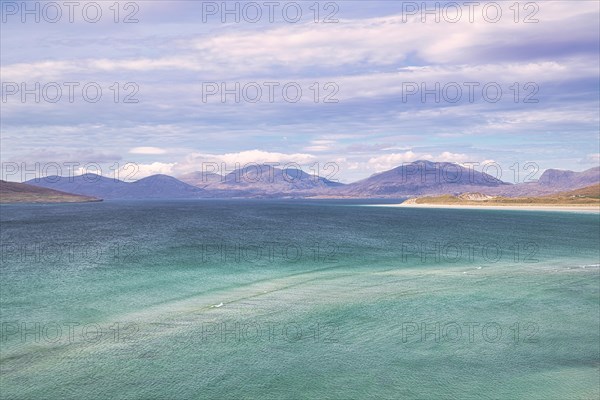 Coastline with sandy beach and mountains