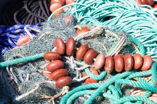 Fishing nets and buoys in the harbour of Port de Centuri