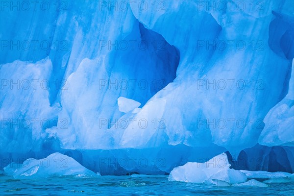 Ice cave at a t glacier in the arctic by the sea