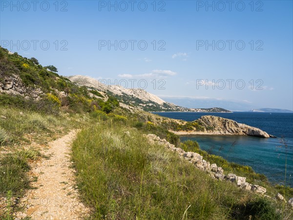 Path leads to a bay with karst rocks