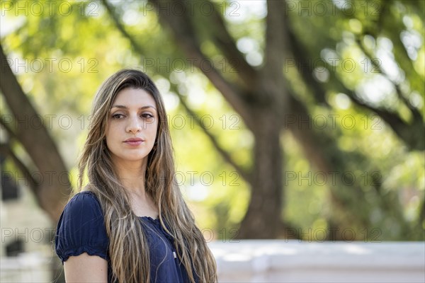 Thoughtful blond young woman with a lost look