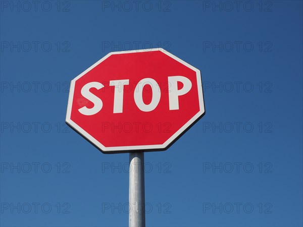 Stop sign over blue sky