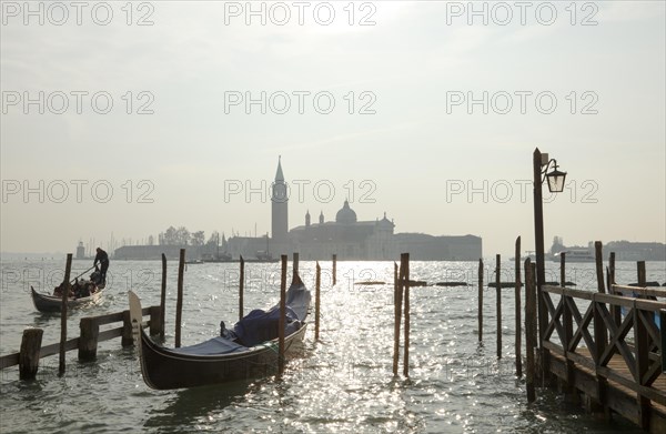 Moored gondolas at the Bacino di San Marco with the church of San Giorgio Maggiore