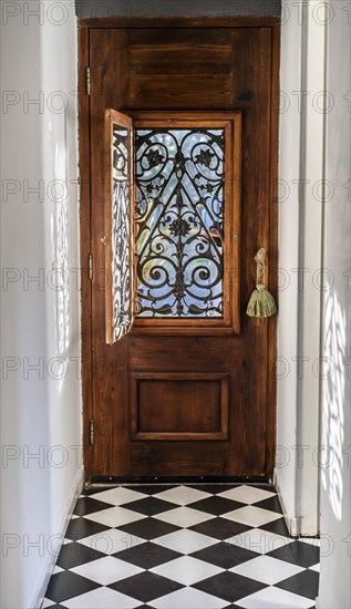 Trendy wooden front door from the inside house