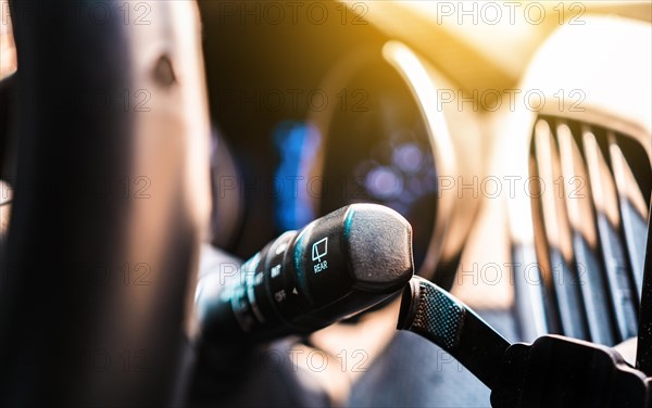 Car wiper control switch. Close-up of control lever for windshield wipers and washers of a car