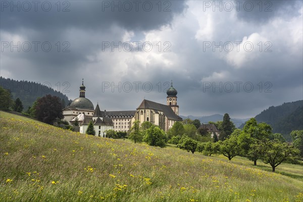 Thunderclouds pass over the Muenstertal and the monastery of Sankt Trudpert