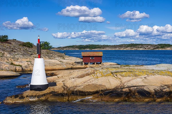 Beach hut and sea mark on an archipelago off Stroemstad