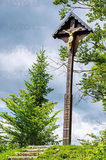 Crucifix on a hill at the end of a cross path