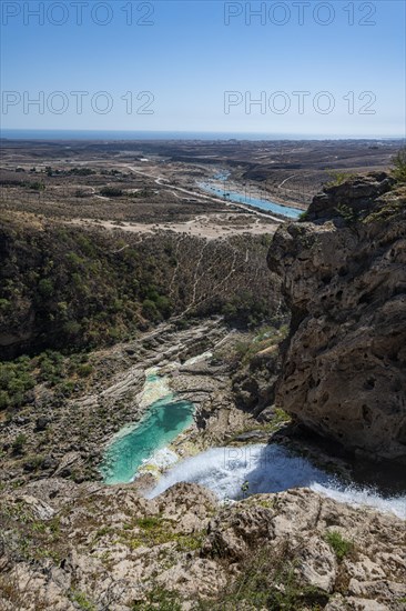 Huge waterfall with turquoise rockpools