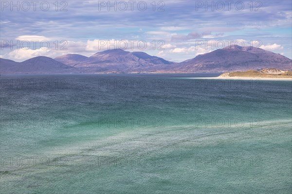 Coastline with sandy beach and mountains