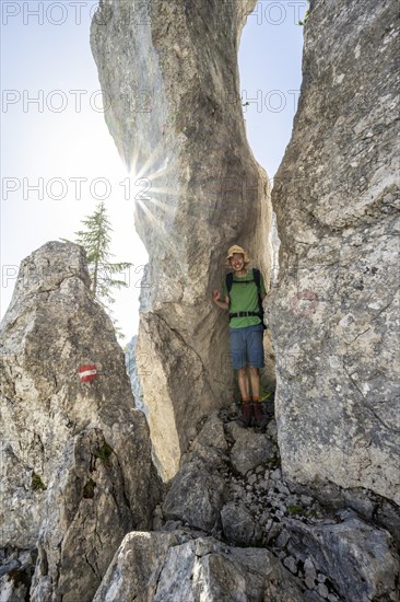 Climbers in a narrow rock passage