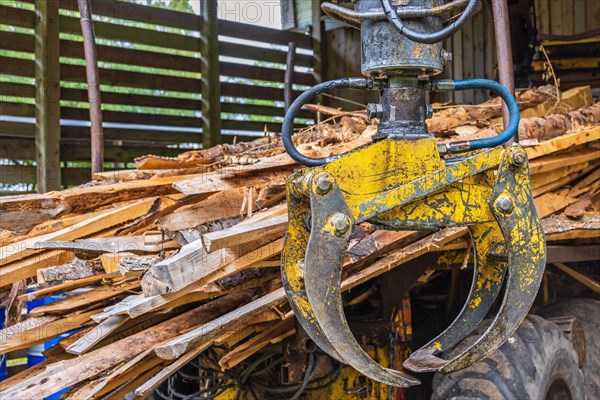 Machine Crane on a forestry vehicle forwarder to lifting logs