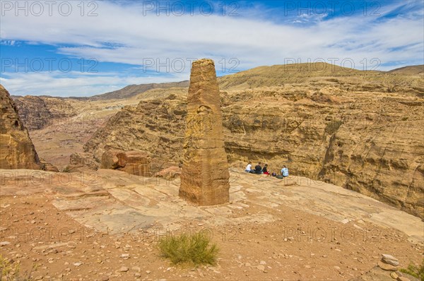 Obelisk in the rock vegetation