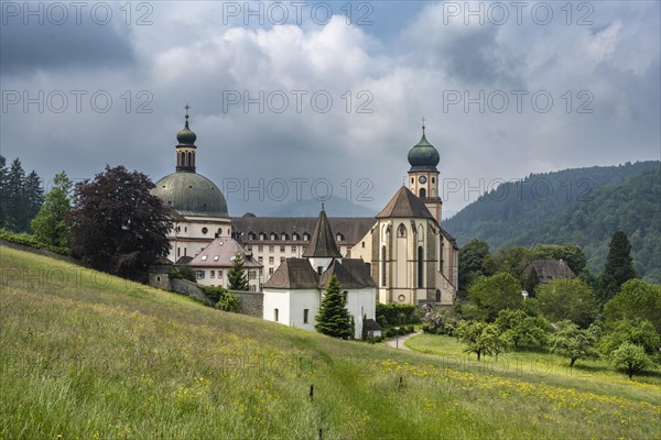 Thunderclouds pass over the Muenstertal and the monastery of Sankt Trudpert