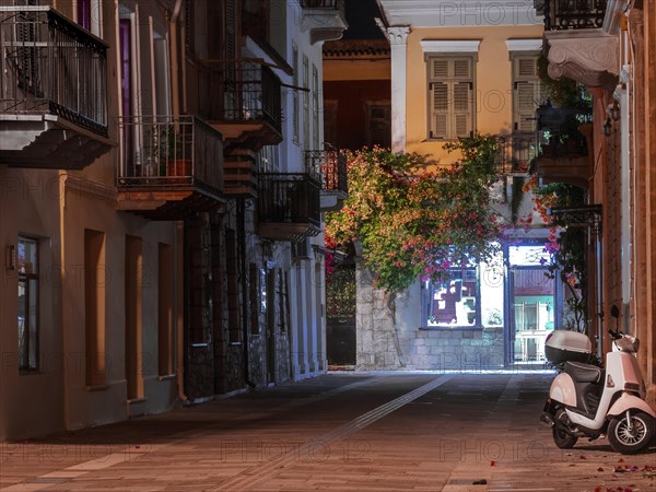 View of a narrow street and cafe in Nafplio