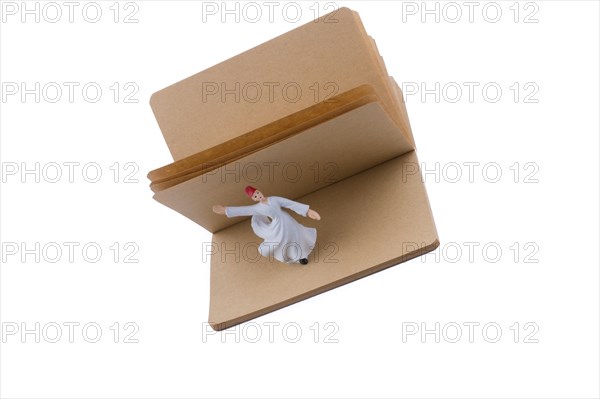Sufi Dervish on a notebook on white background
