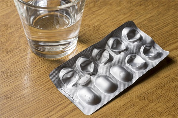 Medicines with a glass of water