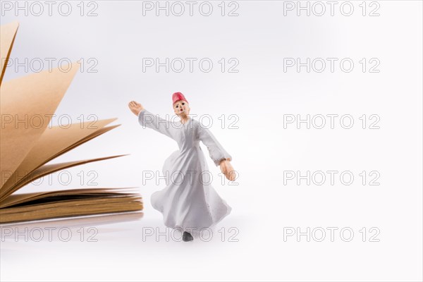 Sufi Dervish on a notebook on white background