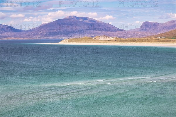 Coastline with sandy beach and mountains