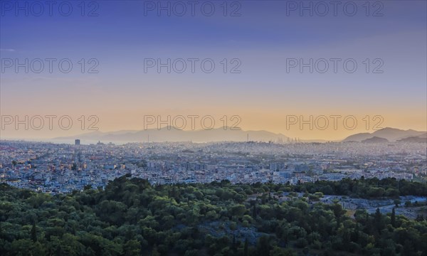 View of Athens and Pireus port from Acropolis hill against sunset