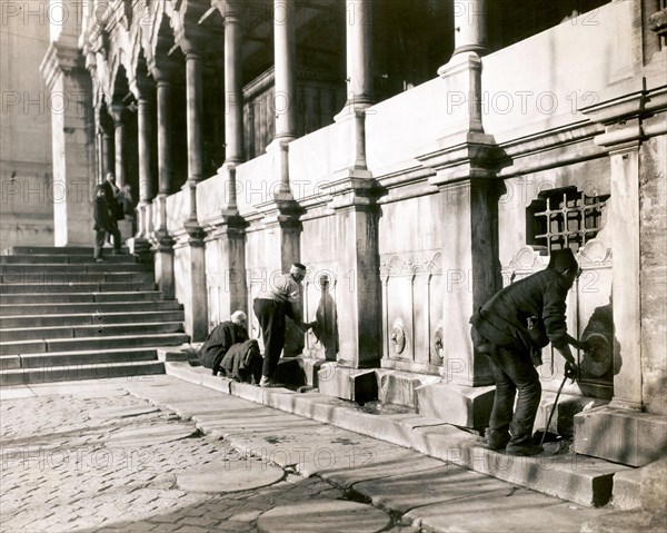 Muslims washing their hands and feet in front of entering a mosque in Stamboul