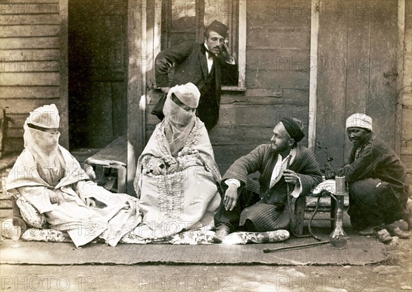 Turkish family in front of their home