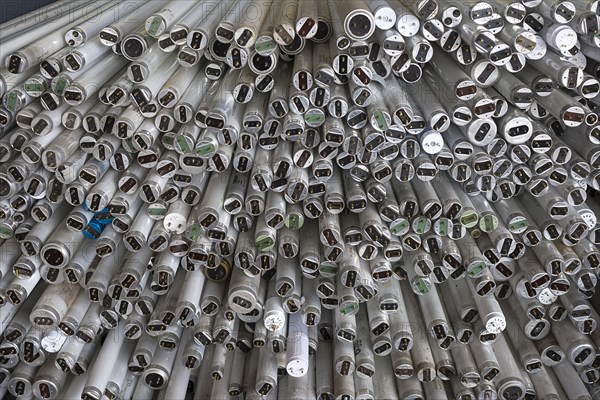 Broken fluorescent tubes stacked in a container