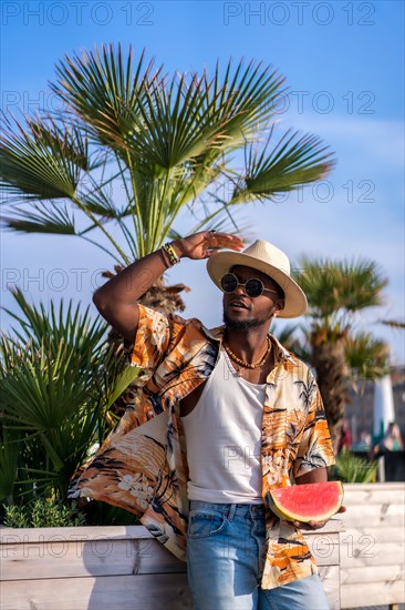 Black ethnic man enjoy summer vacation on the beach