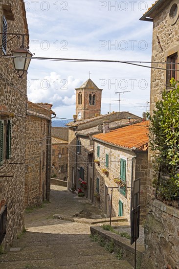 Medieval alley and clock tower