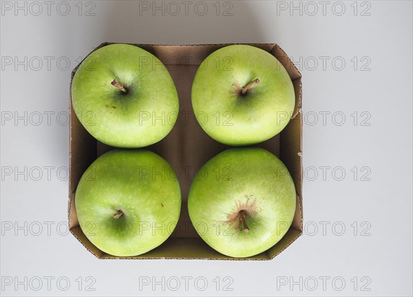 Granny Smith apple fruit food in cardboard basket