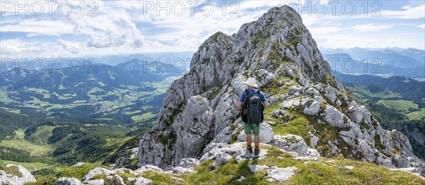 Mountaineer on a narrow ridge path
