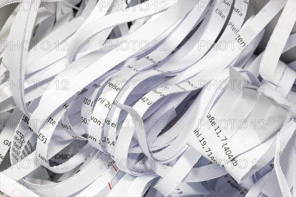 Paper strip documents made unrecognisable in the shredder