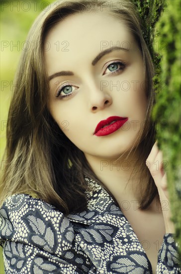 Beautiful young woman looking away