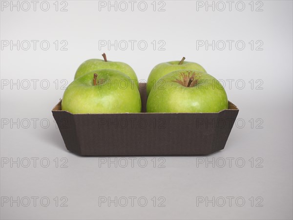 Granny Smith apple fruit food in cardboard basket