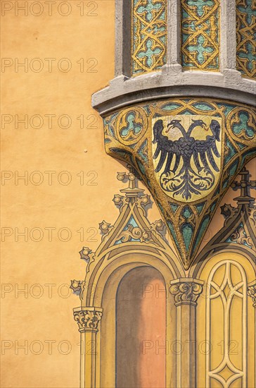 Bay window with fresco of a coat of arms with double-headed eagle on the south-east corner of the historic