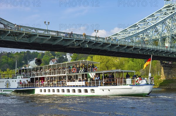 The historic paddle steamer PD LEIPZIG passes under the Blue Wonder in the Blasewitz district