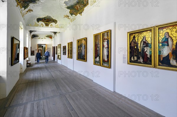 Long corridor with ceiling fresco and paintings