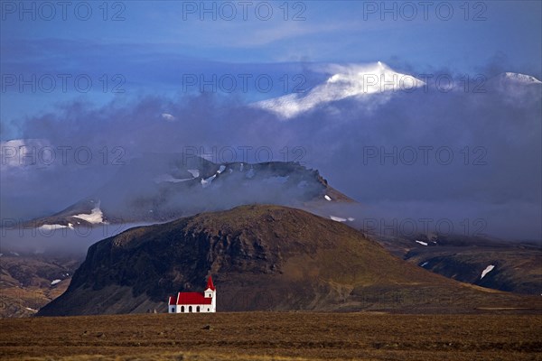 The Snaefellsjoekull with the small church Ingjaldsholskirkja