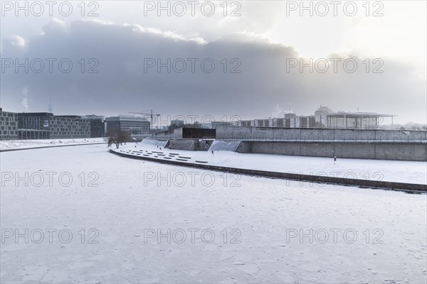 The Reichstag building stands out in the sunshine after heavy snowfall in the government district in Berlin