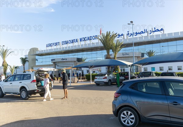 Cars parked outside airport terminal building