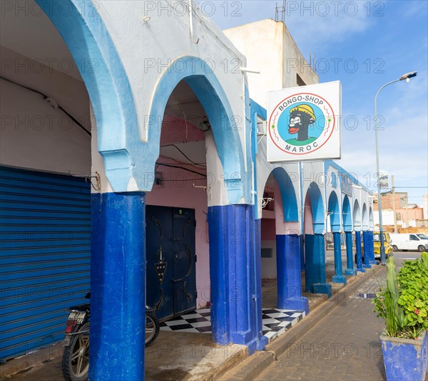 Historic buildings shops and hotel in arcaded shopping street in town centre