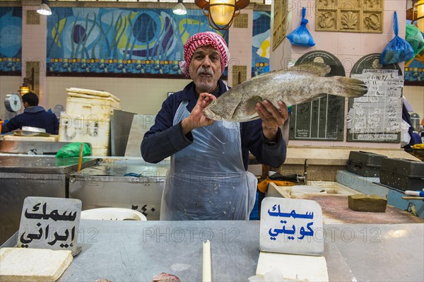 Local fisher man showing his fish