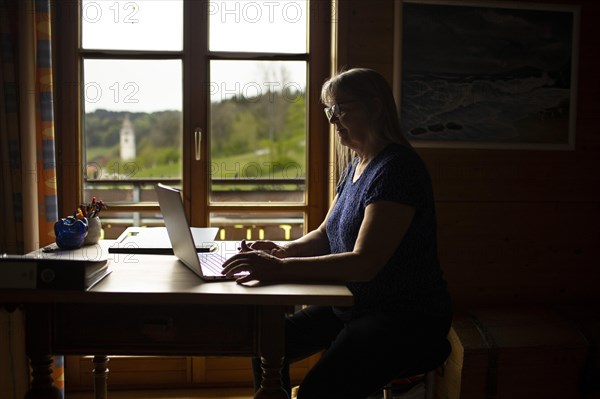 Woman in home office in Niedersonthofen