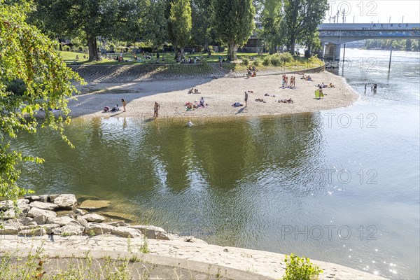 Bathing place on the beach of the Rhine at the Birskoepfli Rhine Park in Basel