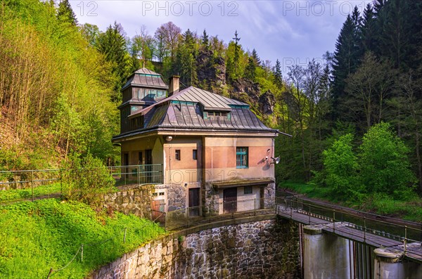 Old hydroelectric power plant power station from 1926 on the Rieger Trail in the valley of the Jizera River near Bitouchov