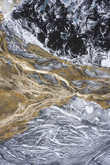 Aerial view over the glacial Virkisa River basin along the Glacier Falljoekull in winter in Austurland