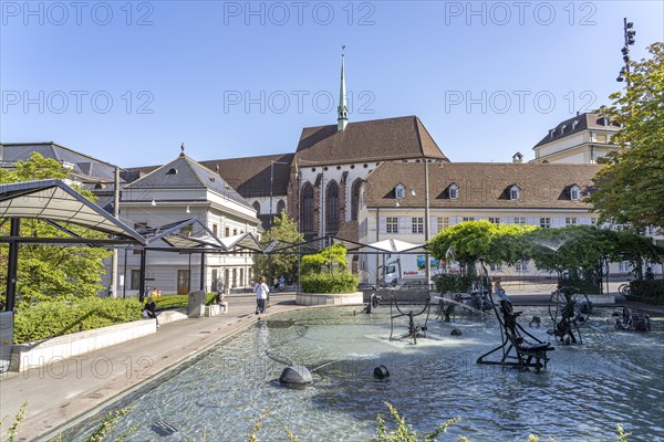 The Fasnacht Fountain or Tinguely Fountain on Theaterplatz and the Elisabethen Church in Basel